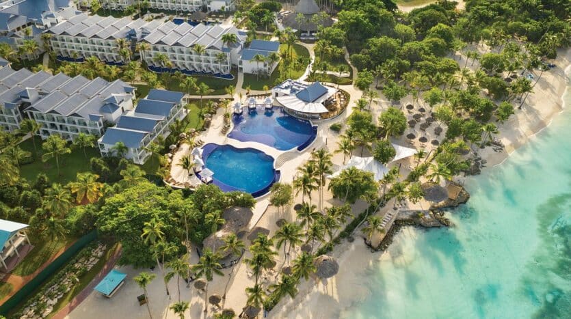 Beachfront resort in La Romana, Dominican Republic with palm trees, white sand, and turquoise Caribbean waters