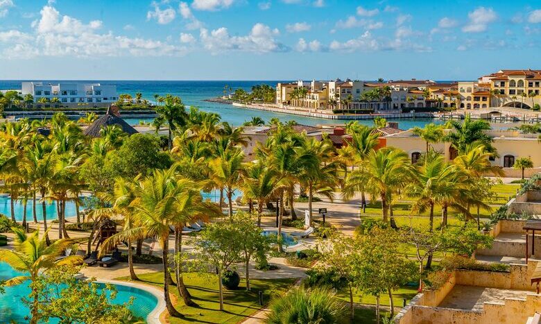 Sunset over Cap Cana Marina, Dominican Republic, with vibrant sky reflections.