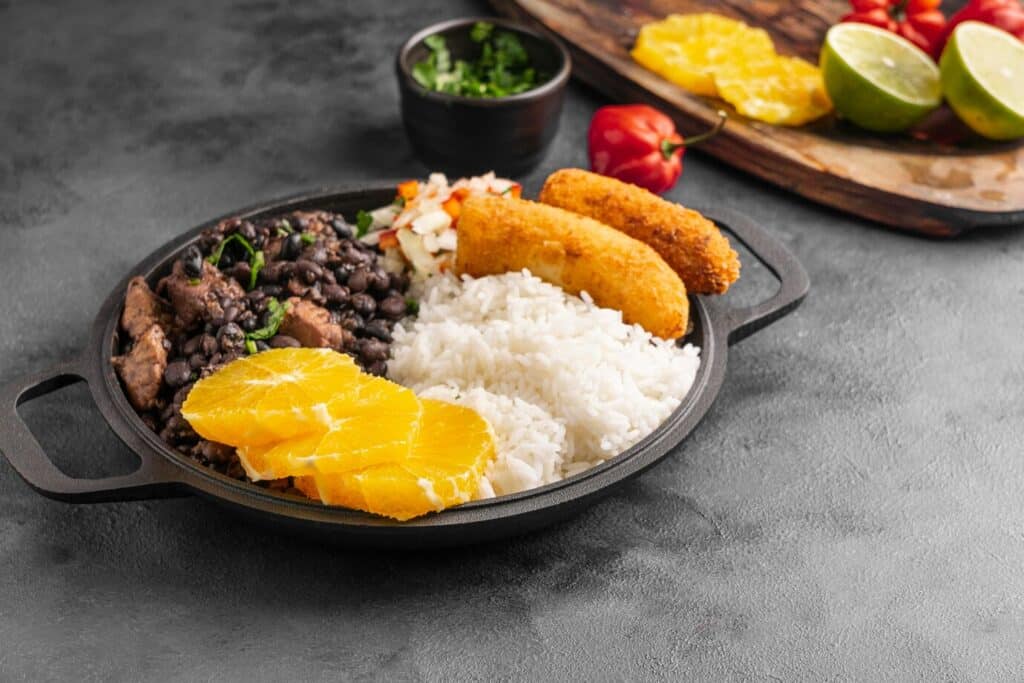 Mangú with fried eggs, cheese, and salami served in a traditional Dominican breakfast.