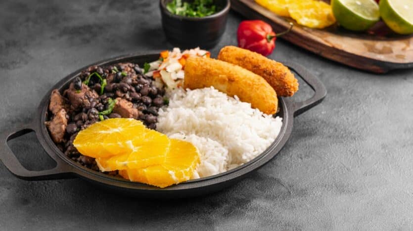 Mangú with fried eggs, cheese, and salami served in a traditional Dominican breakfast.