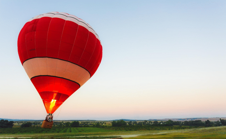 Family with children enjoying a safe hot air balloon ride over the Dominican Republic’s countryside.