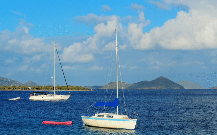 Fishing boat with tourists heading out from Samaná Bay for a deep-sea fishing trip.