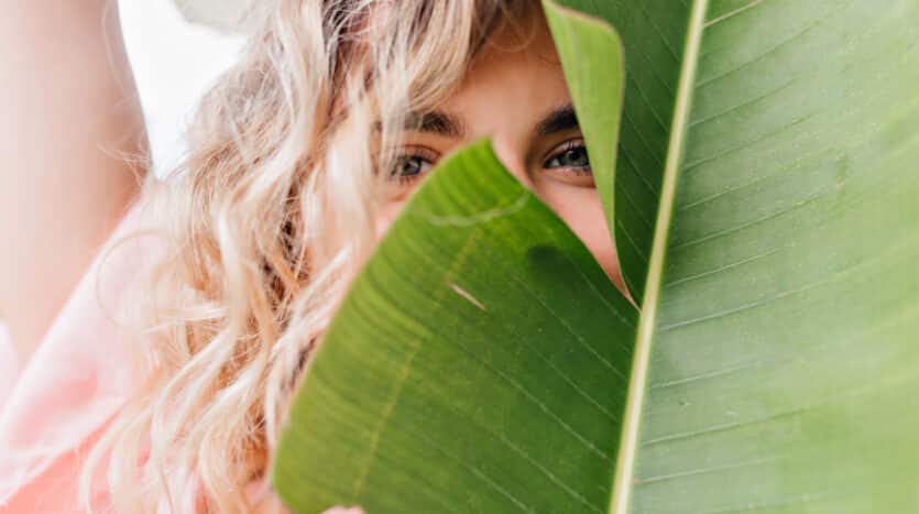 Eco-conscious traveler hiking through a protected natural reserve in the Dominican Republic.