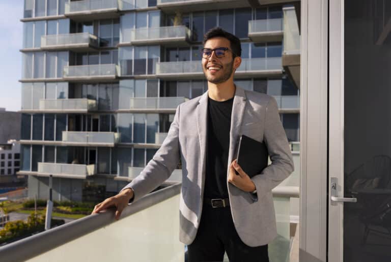 Real estate advisor in a New York office reviewing property listings in the Dominican Republic.