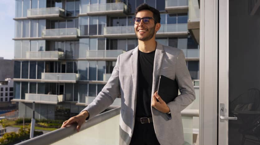 Real estate advisor in a New York office reviewing property listings in the Dominican Republic.