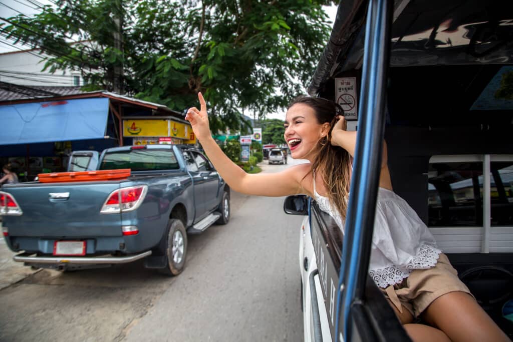 Motoconcho driver waiting for passengers on a busy street in the Dominican Republic.