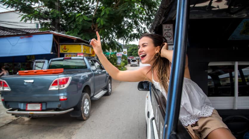 Motoconcho driver waiting for passengers on a busy street in the Dominican Republic.