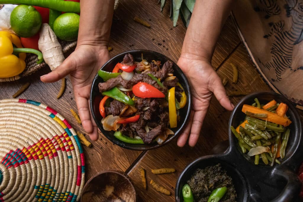 Trendy vegan café interior in Santo Domingo with minimalist décor and plant-based dishes on display.
