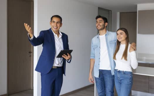 Real estate consultant in a Toronto office presenting Dominican Republic property options to clients.